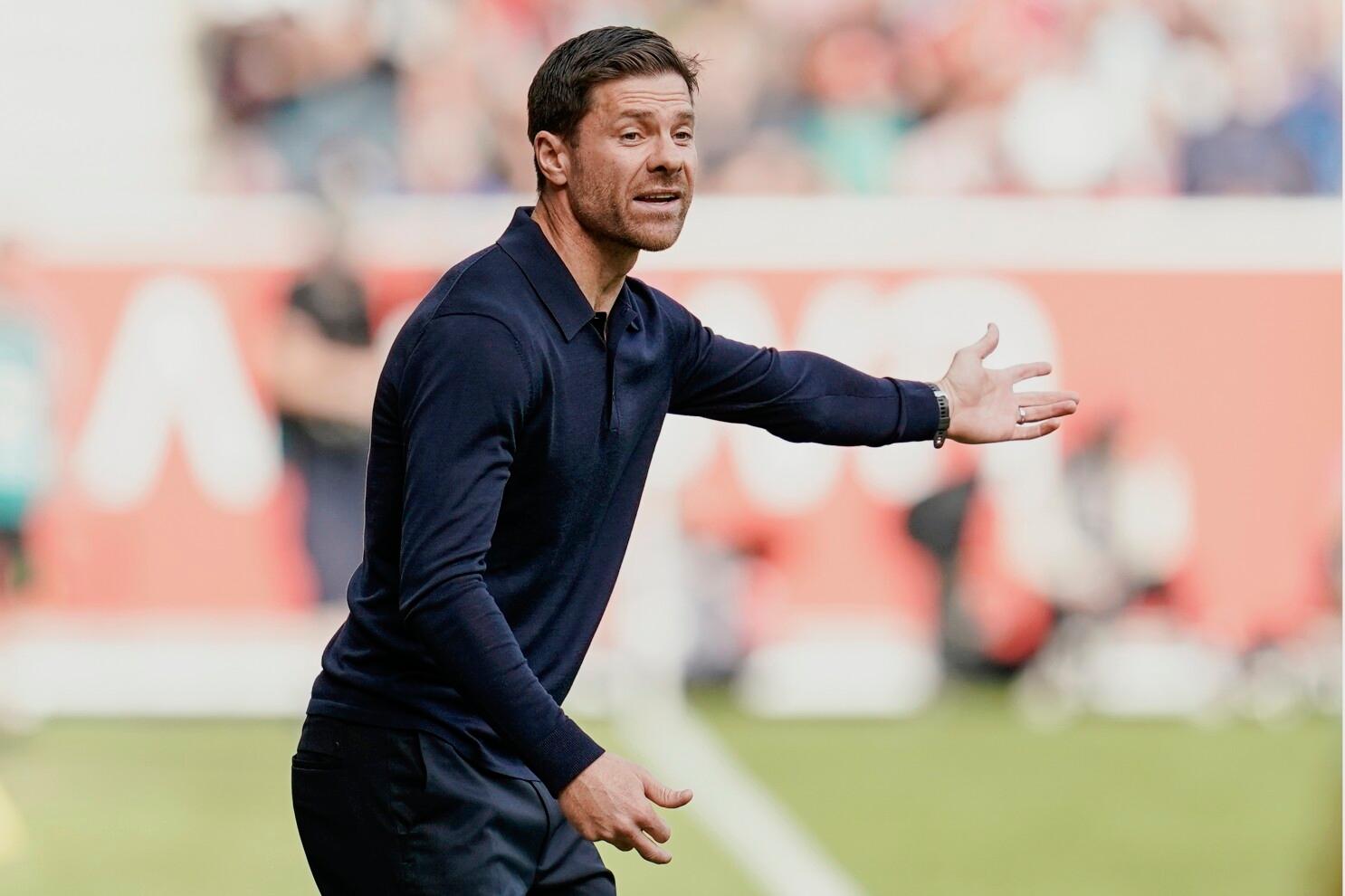 Leverkusen coach Xabi Alonso gives directions to his players during a German Bundesliga soccer match between FSV Mainz 05 and Bayer Leverkusen, at the Mewa Arena in Mainz, Germany, Saturday Sept. 30, 2023. (Uwe Anspach/dpa via AP)